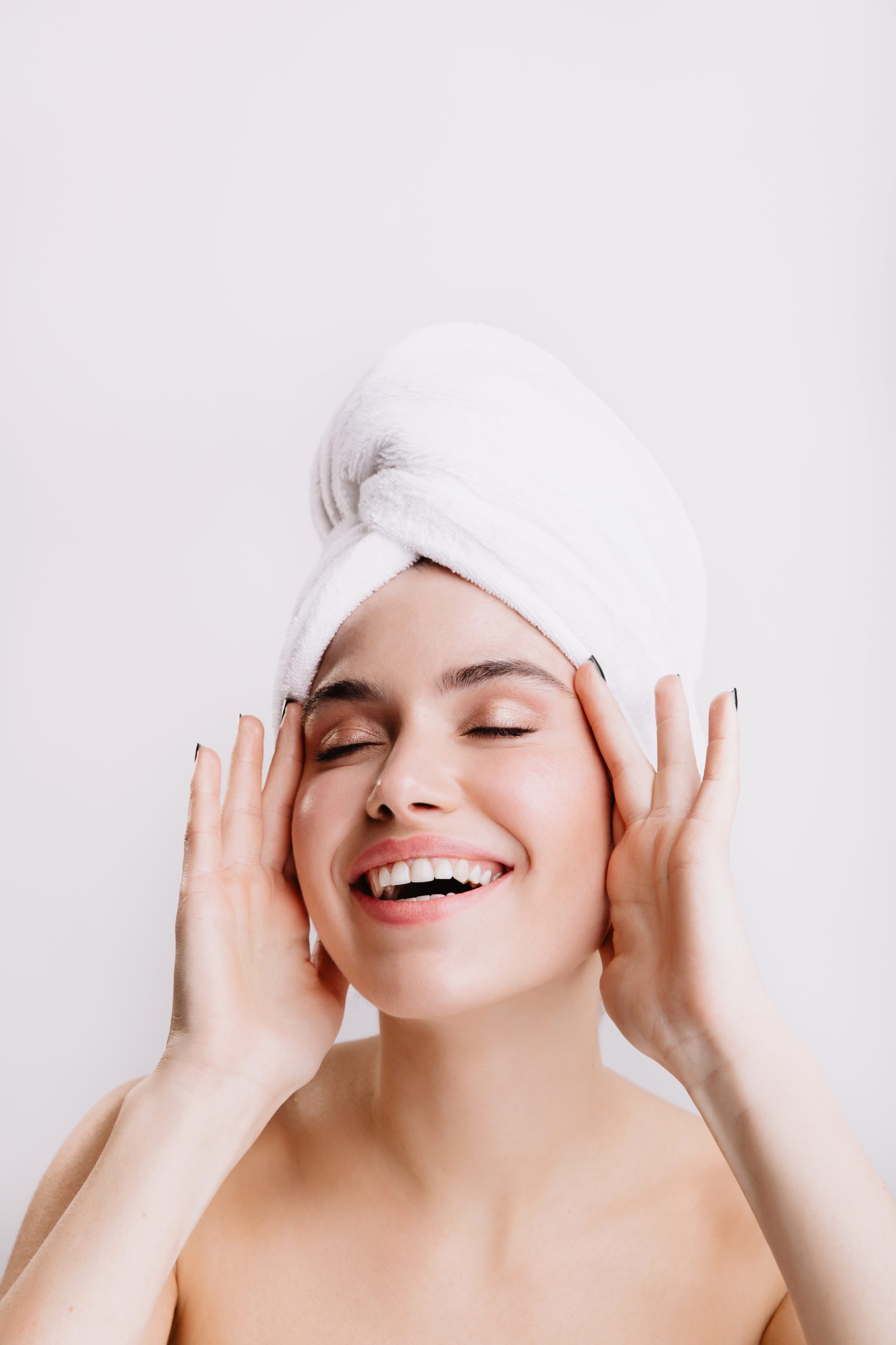 positive lady enjoys morning spa treatment girl after shower posing isolated wall scaled